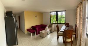 a living room with a couch and a table at Apartaestudio Perdomo Shantiers en San Andres Islas in San Andrés