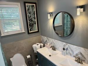 a bathroom with a sink and a mirror at Newly Remodel Wine-Country Retreat in Fallbrook +27 photos