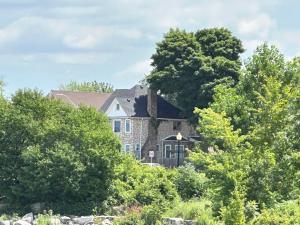 a house with a tree on top of it at Waterfront Home Windsor ,Canada in Windsor