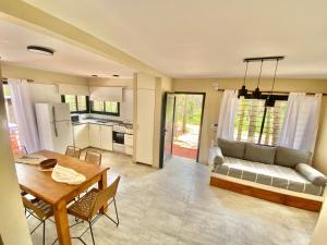 a living room with a couch and a table at BOSQUE LIBERTAD Casa Planta Baja in Mar Azul