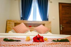 Postel nebo postele na pokoji v ubytování Adhi Homestay
