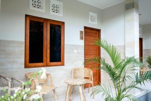 Posezení v ubytování Adhi Homestay
