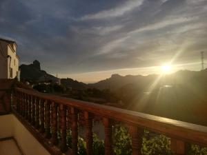 a view of the sun setting from a balcony at Casa La Parra in Tejeda +6 photos