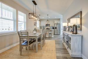 a kitchen and dining room with a table and chairs at Fancy Finish Cottage in Ocean Shores