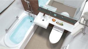 a bathroom with a sink and a bath tub at Hotel Quest Shimizu in Shizuoka