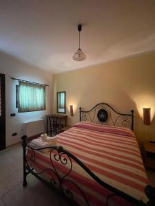 A bed or beds in a room at Agriturismo Salento Pietralata
