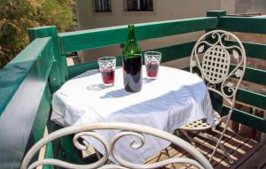 a bottle of wine sitting on a table with glasses at 1 Bedroom Nice Home In Tisno in Tisno
