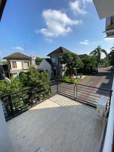 a balcony with a fence in front of a house at Merapi View Homestay in Ngaglik