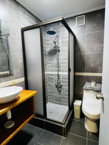 Koupelna v ubytování Pewma House, by Pewma Apart Hotel + 11 fotografií