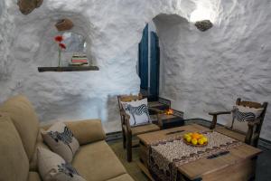 a living room with a couch and a table at Balcones de Piedad in Los Balcones