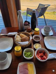 a table topped with plates and bowls of food at CASA NEGRA SANTO DOMINGO in Santo Domingo +25 photos
