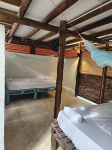 Postel nebo postele na pokoji v ubytování El Hamaquero Hostal EcoNativo