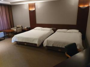 Postel nebo postele na pokoji v ubytování Mstay Hotel