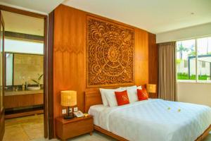 Voodi või voodid majutusasutuse Vimala 1 BR Deluxe Garden With Private Beach ZN132 toas