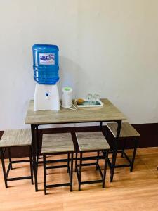 a table with a food processor on top of it at Emelita affordable bed and breakfast in Dauis