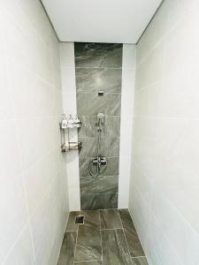 a bathroom with a shower in a wall at OceanPark Amazing Cozy Modern great view 3Beds in Gia Lâm Pho