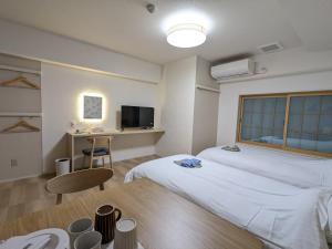 Nikko Beans Hotel客房内的一张或多张床位