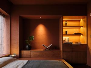 Uma cama ou camas num quarto em After Chapter Hotel Gwanganri