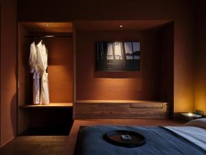 Uma cama ou camas num quarto em After Chapter Hotel Gwanganri