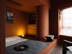 Uma cama ou camas num quarto em After Chapter Hotel Gwanganri