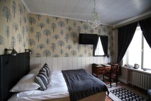 Postel nebo postele na pokoji v ubytování Boutique Hotel Yöpuu