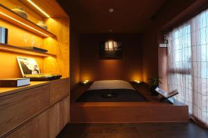 Uma cama ou camas num quarto em After Chapter Hotel Gwanganri