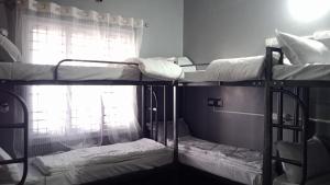 Ліжко або ліжка в номері Da Java 18 hostel and Homestay Chikmagalur