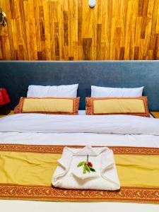 Ένα ή περισσότερα κρεβάτια σε δωμάτιο στο Apex Hotels and Resorts Skardu