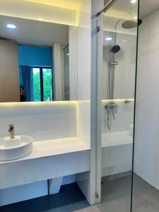a bathroom with a sink and a shower at Sokview Residence in Luang Prabang +18 photos