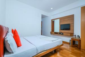 Postel nebo postele na pokoji v ubytování Hotel Janardana