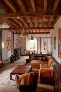 a living room with a couch and a table at Loft industriel aux Grands Moulins de Ruffin in Bréchamps