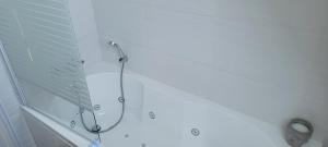 a shower with a shower head in a bathroom at Breizh Villa in Landivisiau +34 photos