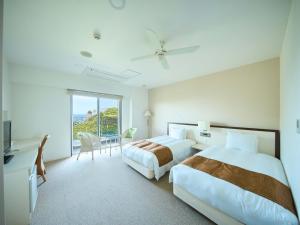 Un pat sau paturi într-o cameră la HOTEL HOLISTIC RESORT - Vacation STAY 34557v