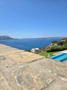a view of the ocean from the roof of a house at Villa Ektoras in Plaka