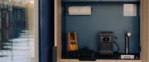 aounter with a soap dispenser and a paper towel at Spreeapartment MARA in Berlin