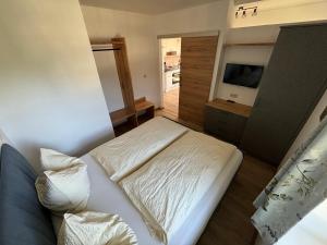 Postel nebo postele na pokoji v ubytování Apartementhaus Schöndorfer
