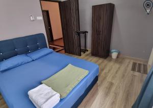 Postel nebo postele na pokoji v ubytování Hana Homestay Kotasas Kuantan