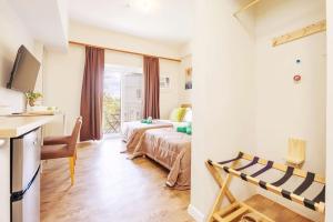 Ένα ή περισσότερα κρεβάτια σε δωμάτιο στο Comfy Studio 5 mins to Mactan Airport