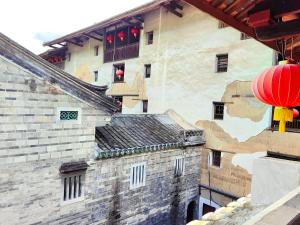Зображення з фотогалереї помешкання Tulou Fuyulou Changdi Inn у місті Yongding