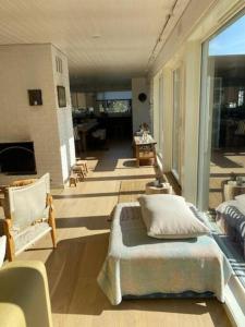 a large room with a bed and a living room at Atriumshus for leie under ONS 2024 in Stavanger