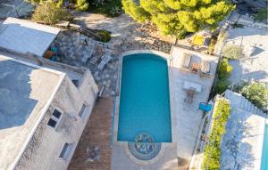 an overhead view of a swimming pool in a house at 5 Bedroom Stunning Home In Zman in Žman +30 photos