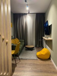 TV a/nebo společenská místnost v ubytování New Gudauri Apartment NEO 223