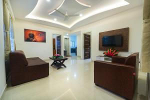 Μια τηλεόραση ή/και κέντρο ψυχαγωγίας στο SIGNATURE HOMES LUXURY SERVICE APARTMENT