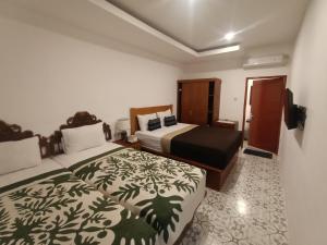 Postel nebo postele na pokoji v ubytování Attara Inn Senggigi