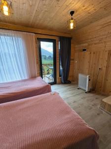 Krevet ili kreveti u jedinici u okviru objekta Guest House in Zhabeshi Lali