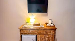 TV a/nebo společenská místnost v ubytování Adhi Homestay