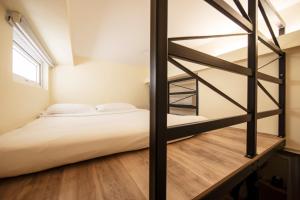 Postel nebo postele na pokoji v ubytování Fragrance Hotel - Balestier