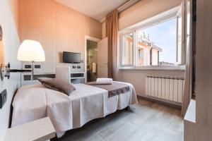 a bedroom with a bed and a window at Hotel Stella Del Mare in Chiavari +187 photos