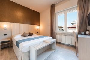 Postel nebo postele na pokoji v ubytování Hotel Stella Del Mare + 37 fotografií