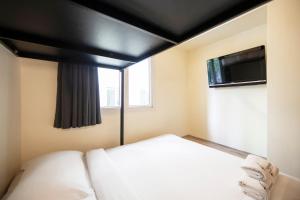Postel nebo postele na pokoji v ubytování Fragrance Hotel - Balestier